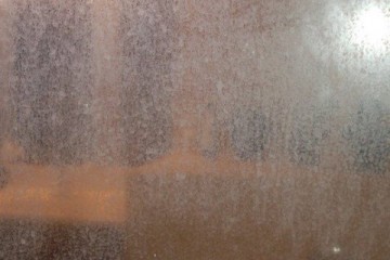 Removing hard water limescale from shower screens Removing hard water limescale from shower screens